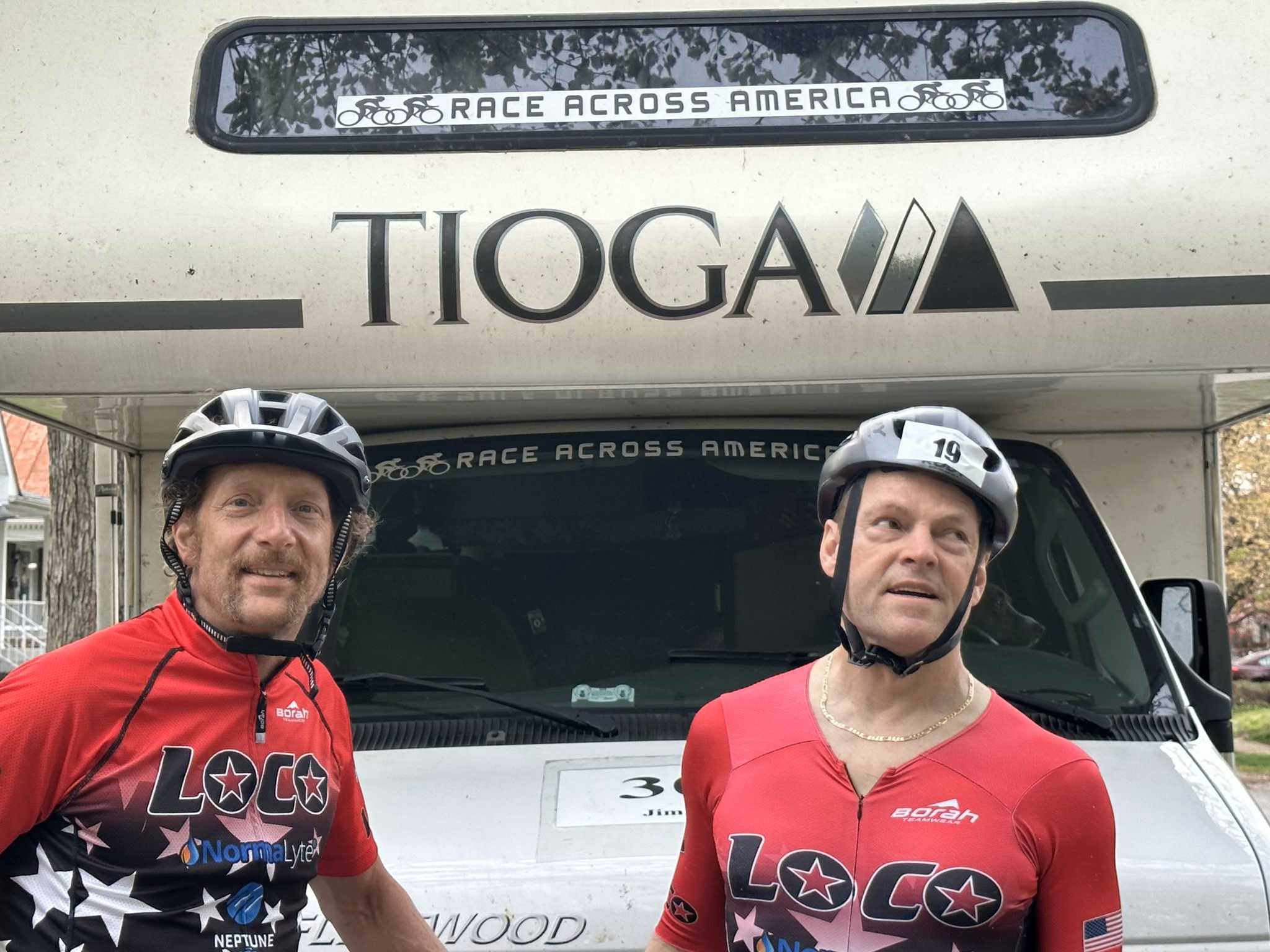 Dave and Jim in front of an RV with a Race Across America sign