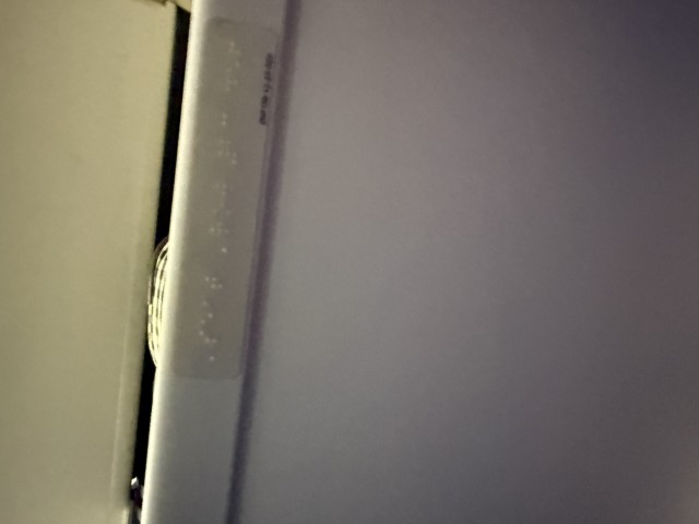 Braille on overhead bin